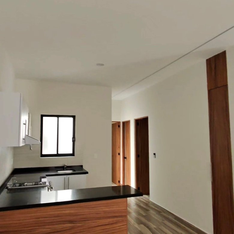 Vista de cocina y pasillo a recamaras en departamento en renta residencial rubi leon modelo jade