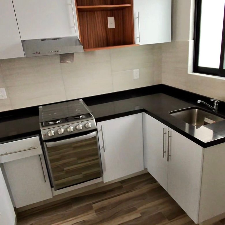 Cocina integral en L con estufa y tarja en departamento en renta residencial rubi leon modelo jade