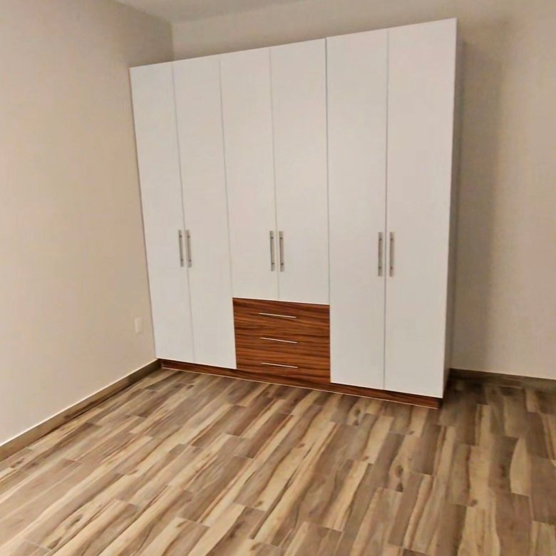 Segunda recamara con closet blanco modular en departamento en renta residencial rubi leon modelo jade