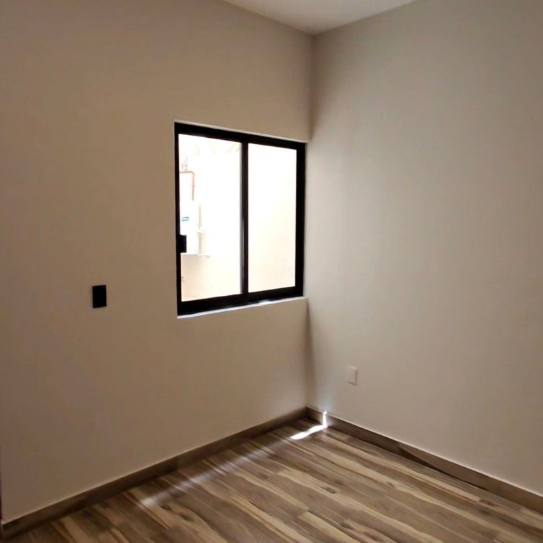 Interior de recamara con ventana e iluminacion natural en departamento en renta residencial rubi leon modelo jade