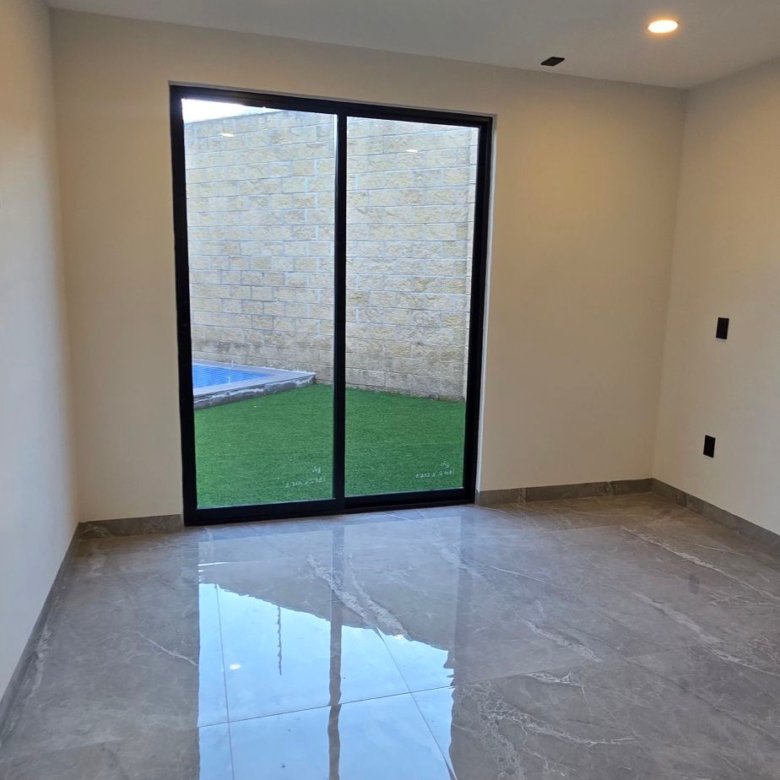 Estancia con vista al jardín en casa en venta El Mayorazgo La Gavia León Gto