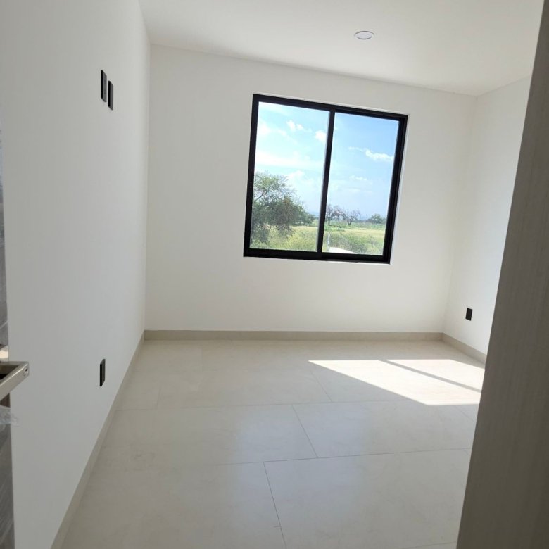 Recámara secundaria con iluminación en casa en venta Mayorca Residencial León